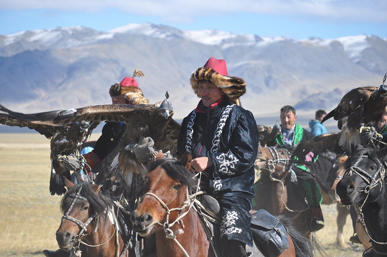 Kazakh eagle hunters on horseback in Bayan-Ölgii